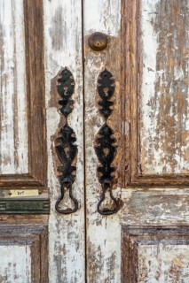 The old town centre of Tavira, typical door knockers found on many wooden doors in the town,