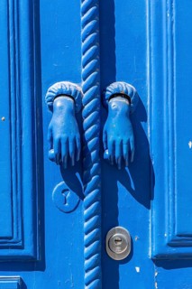 The old town centre of Tavira, typical door knockers found on many wooden doors in the town,