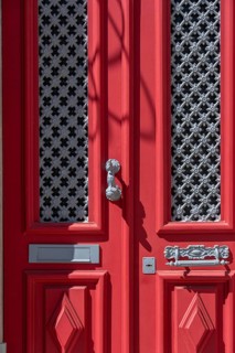 The old town centre of Tavira, typical door knockers found on many wooden doors in the town,