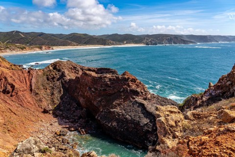 Praia do Amado beach near Carrapateira, popular with surfers, wave riders, rocky coast, steep coast