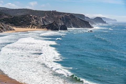 Praia do Amado beach near Carrapateira, popular with surfers, wave riders, rocky coast, steep coast