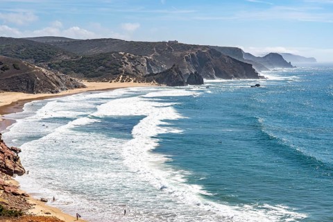 Praia do Amado beach near Carrapateira, popular with surfers, wave riders, rocky coast, steep coast