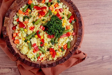 Couscous with vegetables, paprika, carrots, string beans, corn, homemade, top view, no people