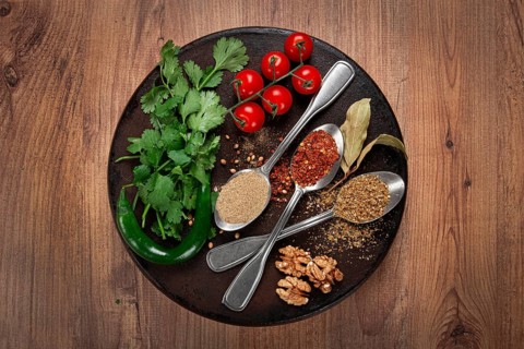 Georgian spices in spoons, on ketsi, top view, no people