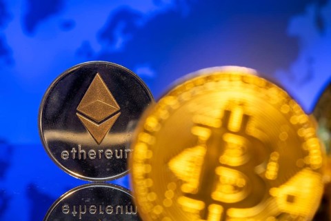 Cryptocurrencies: Close-up of a symbolic Bitcoin and Ethereum