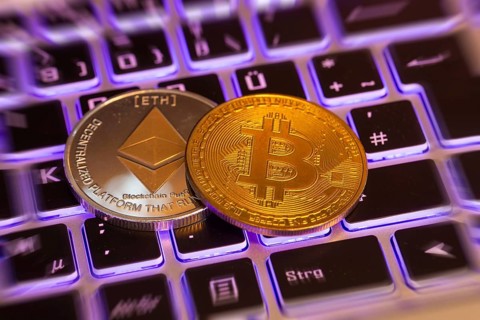 Cryptocurrencies: Close-up of a symbolic Bitcoin and Ethereum