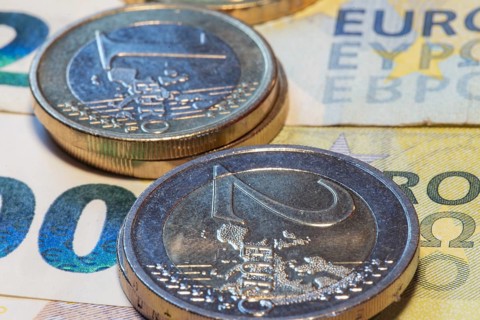 Close-up of euro banknotes and euro coins