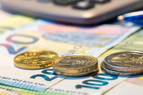 Close-up of euro banknotes and euro coins