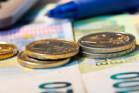 Close-up of euro banknotes and euro coins