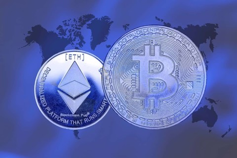 (Photomontage) Cryptocurrencies: Symbolic Bitcoin and Ethereum, cropped in front of a world map