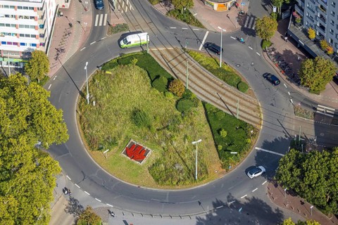 Aerial view, green roundabout and flower bed at D'Agen square and tram line, Dinslaken, Ruhr area,