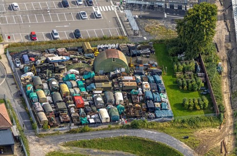 Aerial view, scrap yard with old military trucks at Friedrichsfeld (Lower Rhine) railway station,