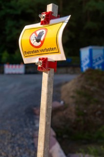 A warning sign with no trespassing on a construction site, Hermann Hessebahn construction site,