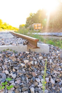 Close-up of a railway track in sunlight on ballast, Hermann Hessebahn construction site, Calw,