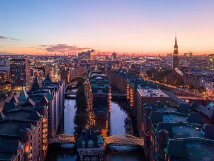 Aerial view of Hamburg's Speicherstadt warehouse district at sunset with a view of the moated