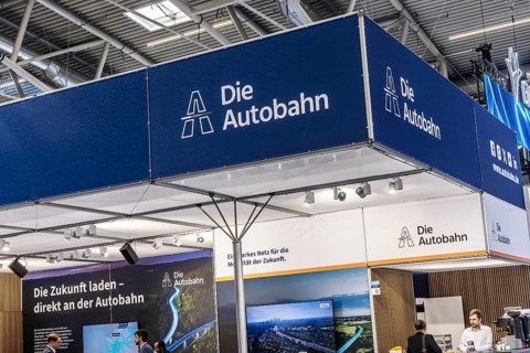 Exhibition stand Die Autobahn GmbH des Bundes. Logo and word mark. IAA MOBILITY in Munich. The