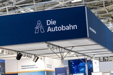 Exhibition stand Die Autobahn GmbH des Bundes. Logo and word mark. IAA MOBILITY in Munich. The