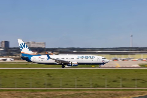 Stuttgart Airport with aircraft on the runway. Aircraft registration number: TC-SNT, SunExpress,