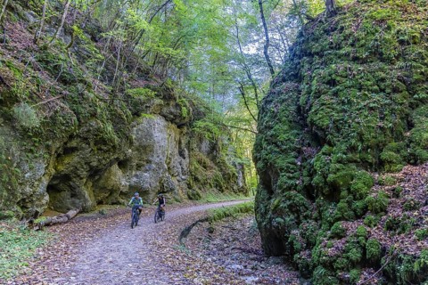 Trailfinger Gorge near Seeburg in the Swabian Alb. Two cyclists on a tour through the romantic