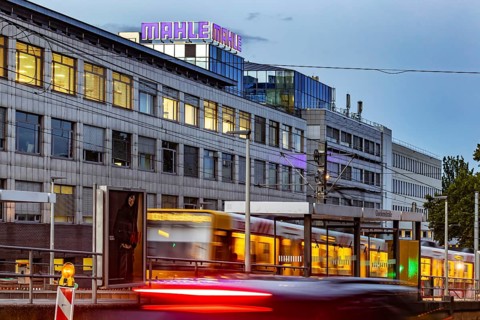 Headquarters of the automotive supplier MAHLE in the evening with the SSB tram. Bad Cannstatt,