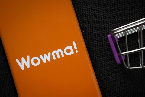 Dhaka, Bangladesh- 03 July 2025: A smartphone displaying the Wowma logo next to a miniature