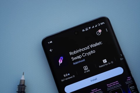 Dhaka, Bangladesh- 29 May 2025: On a blue surface, a smartphone displays the Robinhood Wallet app