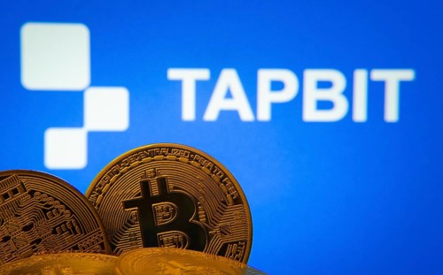Dhaka, Bangladesh- 20 Sep 2025: Close-up of Bitcoin coins with thex Tapbit logo visible on a screen