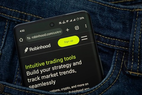 Dhaka, Bangladesh- 15 June 2025: A smartphone displaying the Robinhood web interface peeks out of a
