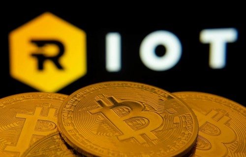 Dhaka, Bangladesh- 20 Sep 2025: Close-up of Bitcoin coins with the Riot Platforms logo visible on a