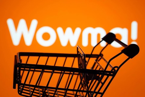 Dhaka, Bangladesh- 03 July 2025: Silhouette of a shopping cart in front of the wowma logo,