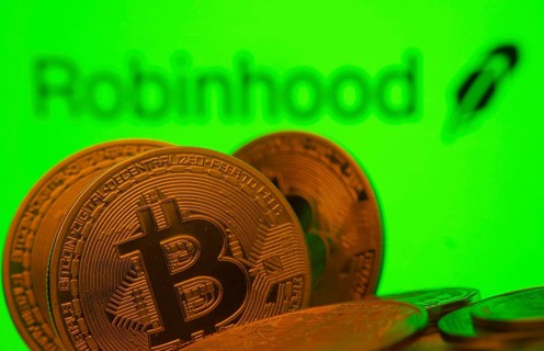 Dhaka, Bangladesh- 20 Sep 2025: Close-up of Bitcoin coins with the Robinhood Markets logo visible