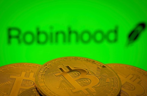 Dhaka, Bangladesh- 20 Sep 2025: Close-up of Bitcoin coins with the Robinhood Markets logo visible