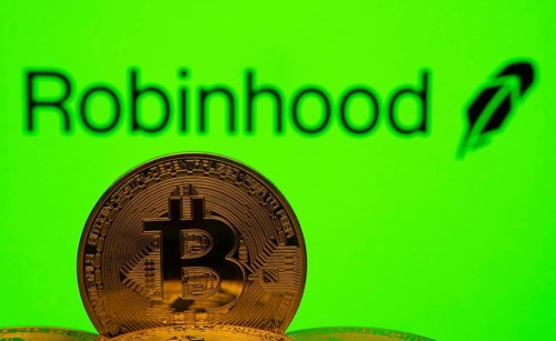 Dhaka, Bangladesh- 20 Sep 2025: Close-up of Bitcoin coins with the Robinhood logo visible on a