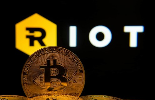 Dhaka, Bangladesh- 20 Sep 2025: Close-up of Bitcoin coins with the Riot Platforms logo visible on a