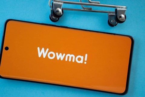 Dhaka, Bangladesh- 03 July 2025: Smartphone screen showing the wowma logo with shopping cart wheels