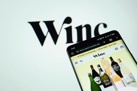 Dhaka, Bangladesh- 03 July 2025: Smartphone displaying Winc web interface against Winc logo