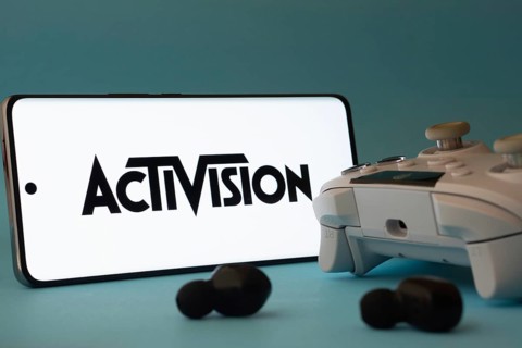 Dhaka, Bangladesh- 23 Sep 2025: A smartphone with a Activision icon next to a controller and