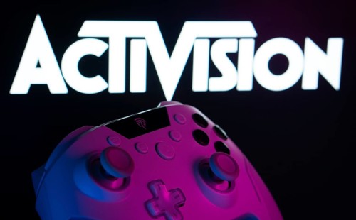 Dhaka, Bangladesh- 23 Sep 2025: A close-up of a white gamepad with the Activision seen on screen in