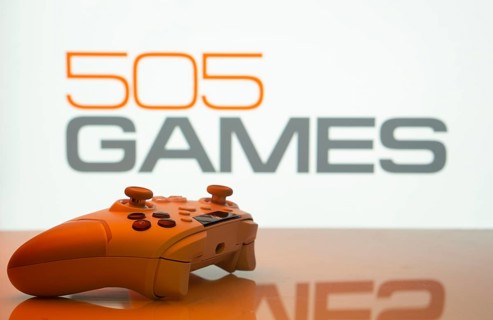 Dhaka, Bangladesh- 23 Sep 2025: Game controller in front of 505 Games logo on a background