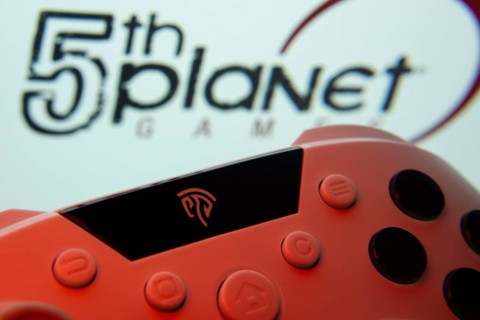 Dhaka, Bangladesh- 23 Sep 2025: A close-up of a gamepad with the 5th planet games seen on screen in