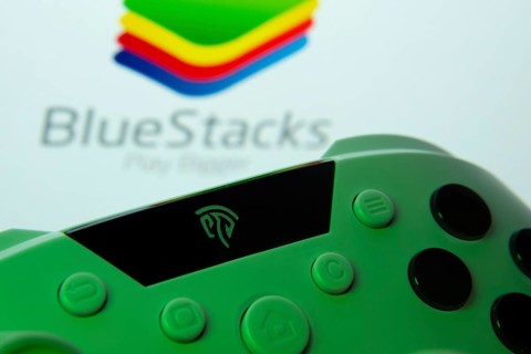 Dhaka, Bangladesh- 23 Sep 2025: A close-up of a gamepad with the BlueStacks seen on screen in the