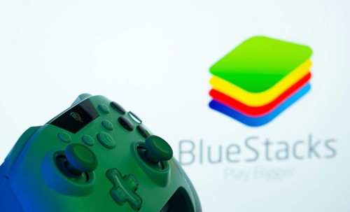 Dhaka, Bangladesh- 23 Sep 2025: A close-up of a gamepad with the BlueStacks seen on screen in the