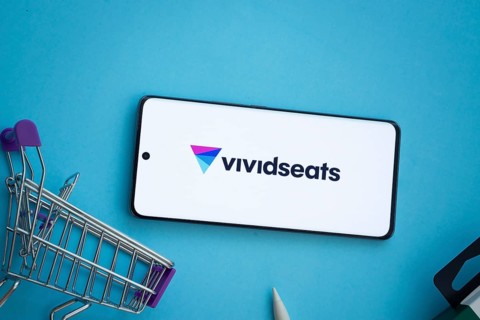 Dhaka, Bangladesh- 03 July 2025: Smartphone displaying VividSeats logo with shopping cart on a blue