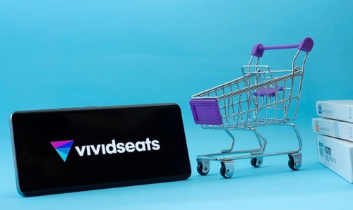 Dhaka, Bangladesh- 03 July 2025: Smartphone with VividSeats logo next to a small shopping cart and
