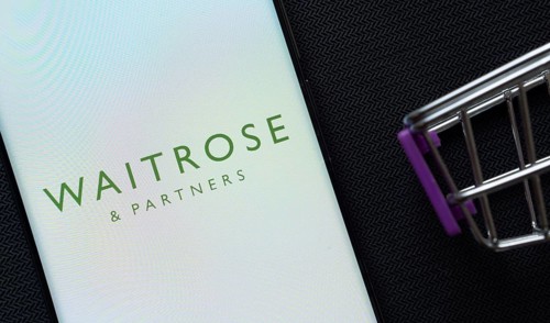 Dhaka, Bangladesh- 03 July 2025: A smartphone displaying the Waitrose & Partners logo next to a