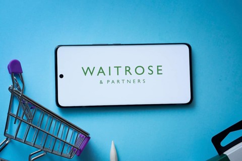 Dhaka, Bangladesh- 03 July 2025: Smartphone displaying Waitrose & Partners logo with shopping cart