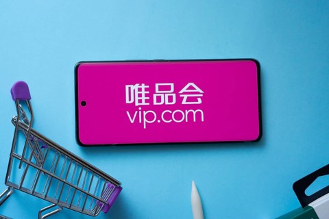 Dhaka, Bangladesh- 03 July 2025: Smartphone displaying vip.com logo with shopping cart on a blue