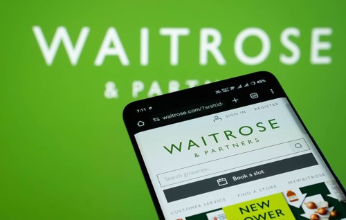 Dhaka, Bangladesh- 03 July 2025: Smartphone displaying Waitrose & Partners web interface against (.