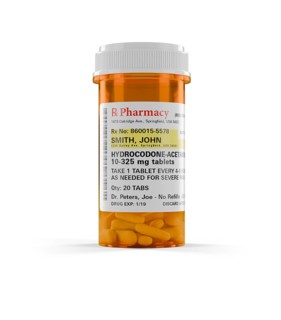 Hydrocodone prescription medicine bottle and pills isolated on a white background. the label is