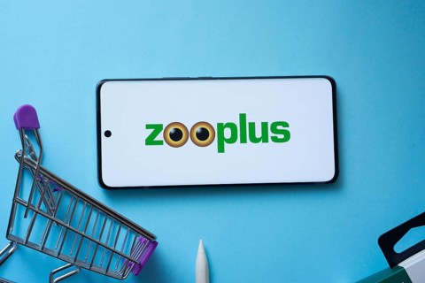 Dhaka, Bangladesh- 03 July 2025: Smartphone displaying zooplus logo with shopping cart on a blue